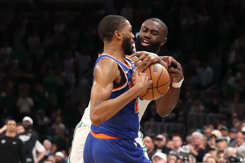 BOSTON, MASSACHUSETTS - MAY 05: Mikal Bridges #25 of the New York Knicks steals the ball from Jaylen Brown #7 of the Boston Celtics during overtime in Game One of the Eastern Conference Second Round NBA Playoffs at TD Garden on May 05, 2025 in Boston, Massachusetts. NOTE TO USER: User expressly acknowledges and agrees that, by downloading and or using this photograph, User is consenting to the terms and conditions of the Getty Images License Agreement. New York defeated Boston 108-105. (Photo by Maddie Meyer/Getty Images)