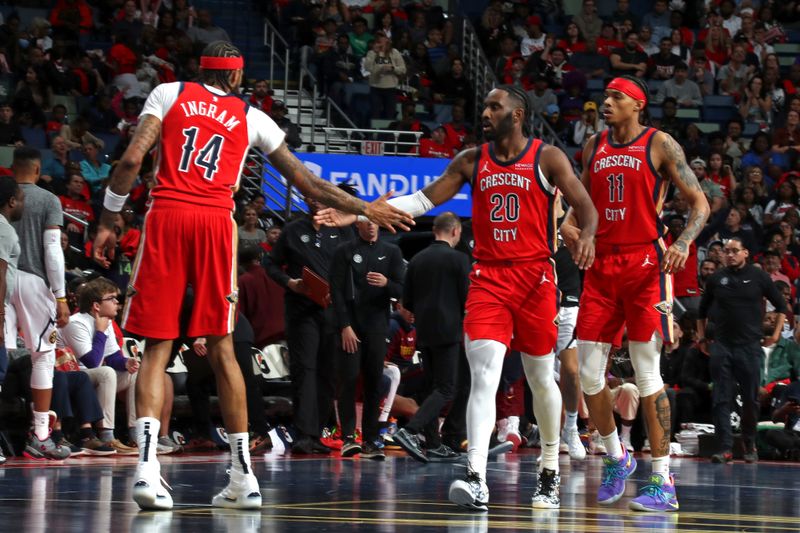 NEW ORLEANS, LA - NOVEMBER 15: Jaylen Nowell #20 and Brandon Ingram #14 of the New Orleans Pelicans high five during the game against the Denver Nuggets during the Emirates NBA Cup game on November 15, 2024 at the Smoothie King Center in New Orleans, Louisiana. NOTE TO USER: User expressly acknowledges and agrees that, by downloading and or using this Photograph, user is consenting to the terms and conditions of the Getty Images License Agreement. Mandatory Copyright Notice: Copyright 2024 NBAE (Photo by Layne Murdoch Jr./NBAE via Getty Images)