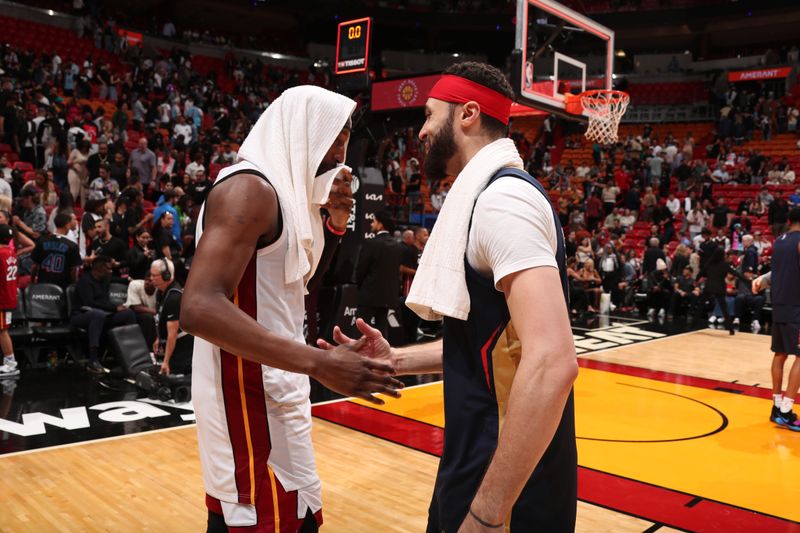 MIAMI, FL - MARCH 22: Larry Nance Jr. #22 of the New Orleans Pelicans talks with Bam Adebayo #13 of the Miami Heat after the game on March 22, 2024 at Kaseya Center in Miami, Florida. NOTE TO USER: User expressly acknowledges and agrees that, by downloading and or using this Photograph, user is consenting to the terms and conditions of the Getty Images License Agreement. Mandatory Copyright Notice: Copyright 2024 NBAE (Photo by Issac Baldizon/NBAE via Getty Images)