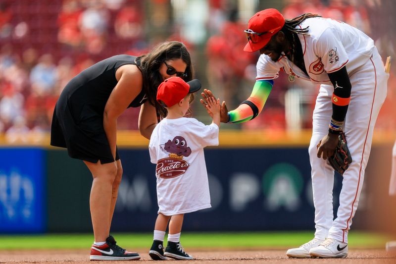 Aug 4, 2024; Cincinnati, Ohio, USA; Cincinnati Reds shortstop Elly De La Cruz (44) high fives a fan before the game against the San Francisco Giants at Great American Ball Park. Mandatory Credit: Katie Stratman-USA TODAY Sports