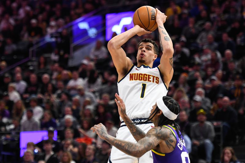 SALT LAKE CITY, UTAH - JANUARY 10: Michael Porter Jr. #1 of the Denver Nuggets shoots over Jordan Clarkson #00 of the Utah Jazz during the second half at Delta Center on January 10, 2024 in Salt Lake City, Utah.  NOTE TO USER: User expressly acknowledges and agrees that, by downloading and or using this photograph, User is consenting to the terms and conditions of the Getty Images License Agreement. (Photo by Alex Goodlett/Getty Images)