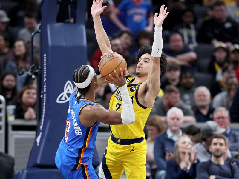 INDIANAPOLIS, INDIANA - MARCH 31:  Andrew Nembhard #2 of the Indiana Pacers defends the shot of Shai Gilgeous-Alexander #2 of the Oklahoma City Thunder at Gainbridge Fieldhouse on March 31, 2023 in Indianapolis, Indiana.    NOTE TO USER: User expressly acknowledges and agrees that, by downloading and/or using this photograph, User is consenting to the terms and conditions of the Getty Images License Agreement. (Photo by Andy Lyons/Getty Images)