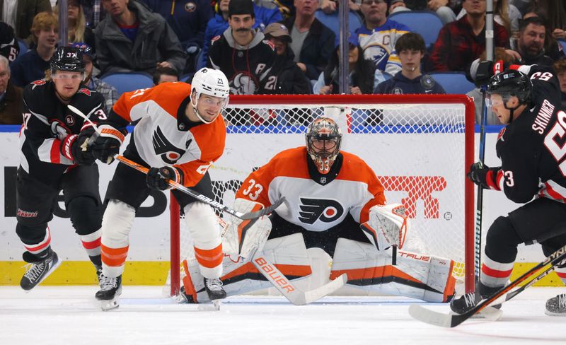 Nov 3, 2023; Buffalo, New York, USA;  Philadelphia Flyers goaltender Samuel Ersson (33) looks for the puck during the third period against the Buffalo Sabres at KeyBank Center. Mandatory Credit: Timothy T. Ludwig-USA TODAY Sports