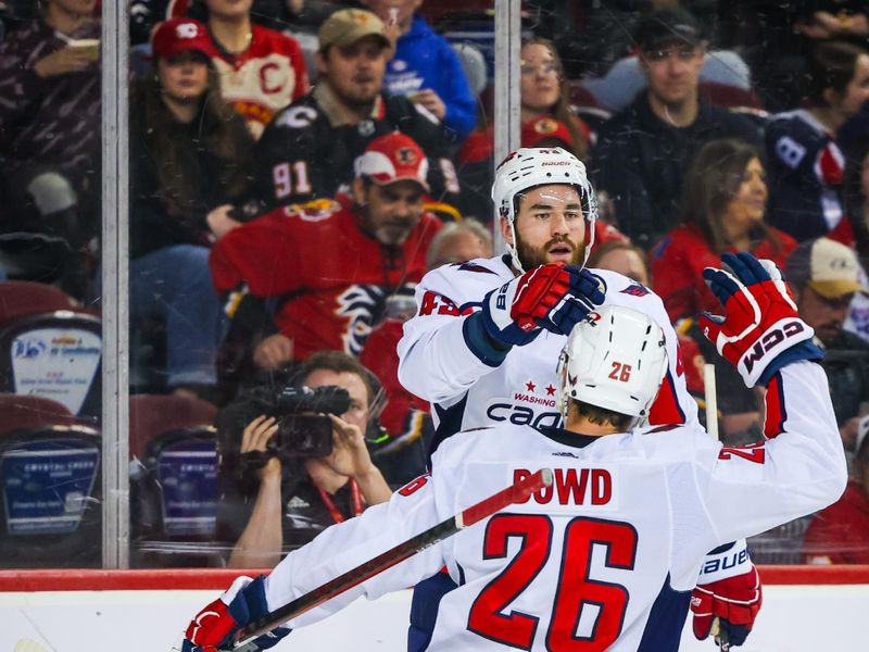 Mar 18, 2024; Calgary, Alberta, CAN; Washington Capitals right wing Tom Wilson (43) celebrates his goal with right wing Nic Dowd (26) during the third period against the Calgary Flames at Scotiabank Saddledome. Mandatory Credit: Sergei Belski-USA TODAY Sports