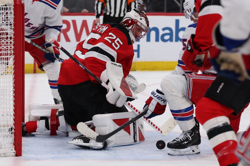 Mar 7, 2026; Newark, New Jersey, USA; New Jersey Devils goaltender Jacob Markstrom (25) follows the puck against the New York Rangers during the third period at Prudential Center. Mandatory Credit: Thomas Salus-Imagn Images