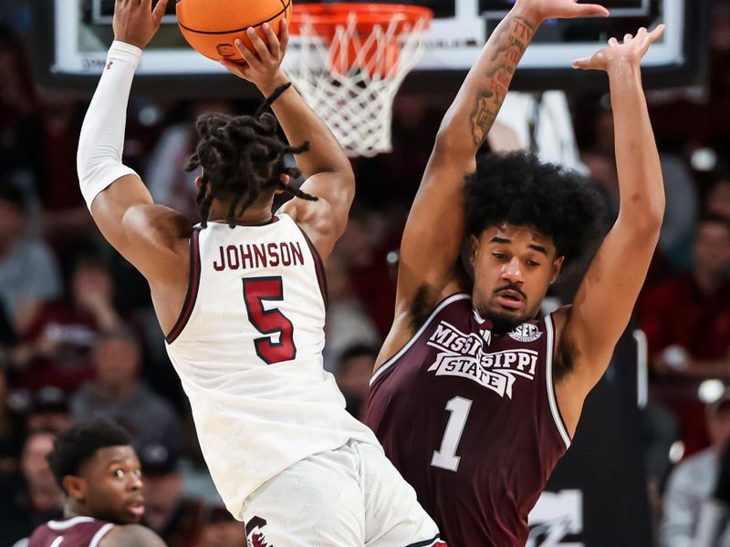 Jan 6, 2024; Columbia, South Carolina, USA; Mississippi State Bulldogs forward Tolu Smith (1) fouls South Carolina Gamecocks guard Meechie Johnson (5) as he attempts a three point basket in the second half at Colonial Life Arena. Mandatory Credit: Jeff Blake-USA TODAY Sports