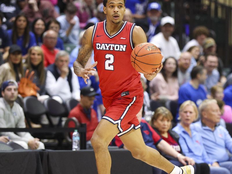 Nov 28, 2025; Kissimmee, FL, USA; Dayton Flyers guard De'Shayne Montgomery (2) controls the ball against the Brigham Young University Cougars in the first half during the ESPN Events Invitational at State Farm Field House. Mandatory Credit: Nathan Ray Seebeck-Imagn Images