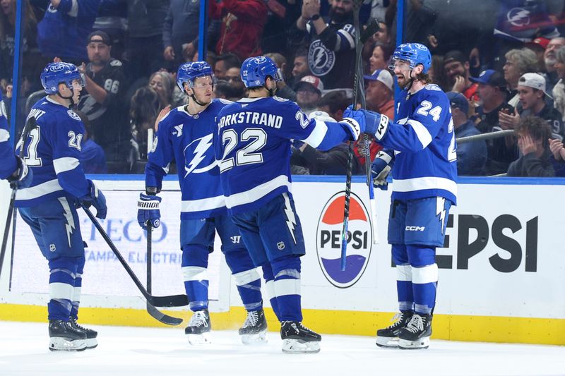 Dec 15, 2025; Tampa, Florida, USA; Tampa Bay Lightning defenseman Maxwell Crozier (24) celebrates with right wing Oliver Bjorkstrand (22) after scoring a goal against the Tampa Bay Lightning in the second period at Benchmark International Arena. Mandatory Credit: Nathan Ray Seebeck-Imagn Images