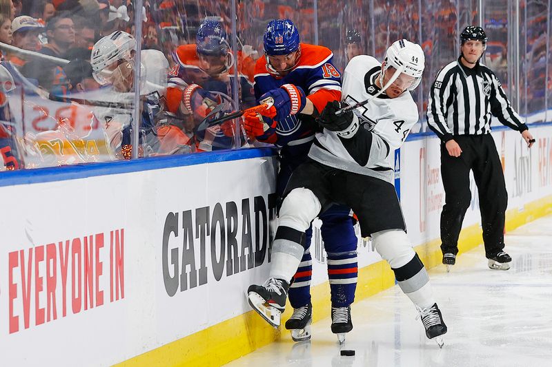 May 1, 2024; Edmonton, Alberta, CAN;Edmonton Oilers forward Zach Hyman (18) and Los Angeles Kings defensemen Mikey Anderson (44) battle along the boards for a loose puck during the third period in game five of the first round of the 2024 Stanley Cup Playoffs at Rogers Place. Mandatory Credit: Perry Nelson-USA TODAY Sports