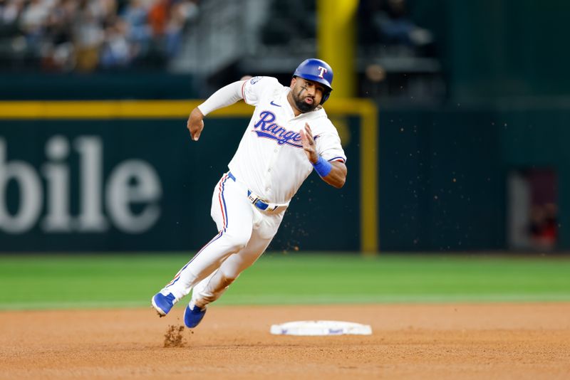 Sep 4, 2024; Arlington, Texas, USA; Texas Rangers third base Ezequiel Duran (20) rounds second base during the fourth inning against the New York Yankees at Globe Life Field. Mandatory Credit: Andrew Dieb-Imagn Images
