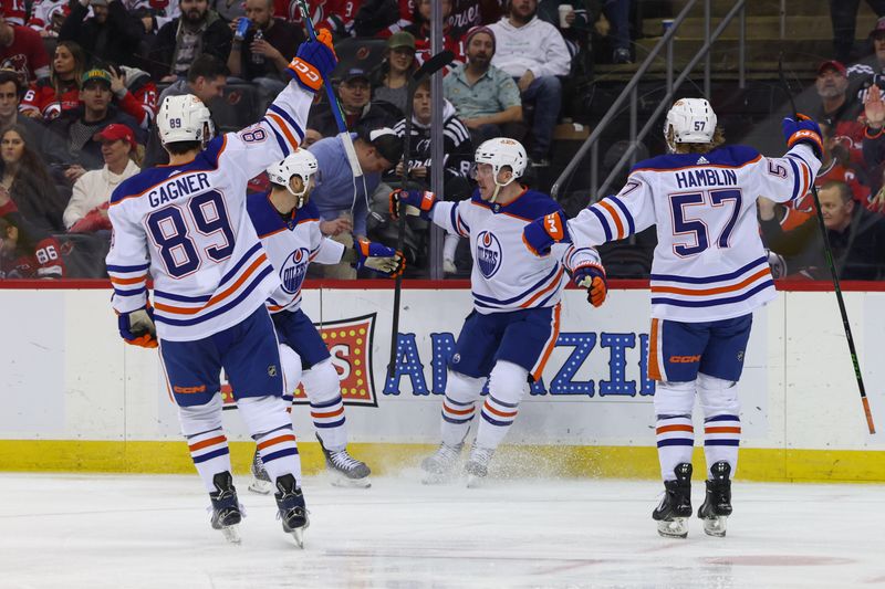 Dec 21, 2023; Newark, New Jersey, USA; Edmonton Oilers left wing Adam Erne (21) celebrates his goal against the New Jersey Devils during the third period at Prudential Center. Mandatory Credit: Ed Mulholland-USA TODAY Sports