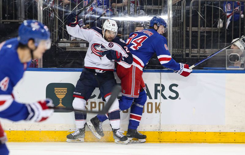 Jan 18, 2025; New York, New York, USA; Columbus Blue Jackets center Zach Aston-Reese (27) collides with New York Rangers center Adam Edstrom (84) during the second period at Madison Square Garden. Mandatory Credit: Danny Wild-Imagn Images