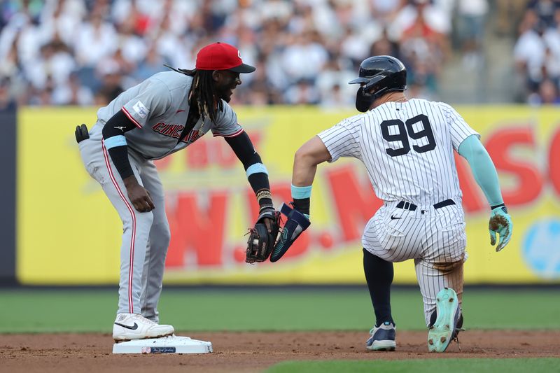 Jul 2, 2024; Bronx, New York, USA; Cincinnati Reds shortstop Elly De La Cruz (44) greets New York Yankees designated hitter Aaron Judge (99) at second base after forcing him out to end the first inning at Yankee Stadium. Mandatory Credit: Brad Penner-USA TODAY Sports