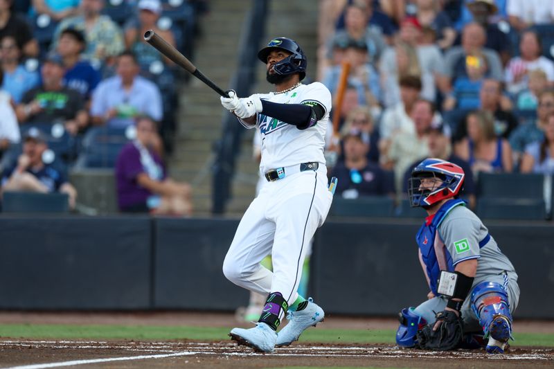 May 24, 2025; Tampa, Florida, USA; Tampa Bay Rays third baseman Junior Caminero (13) hits a three run home run against the Toronto Blue Jays in the first inning at George M. Steinbrenner Field. Mandatory Credit: Nathan Ray Seebeck-Imagn Images