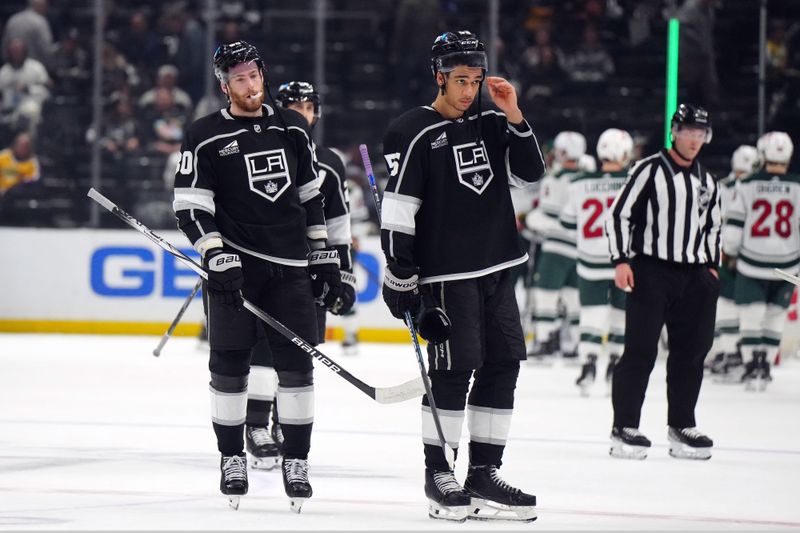 Apr 15, 2024; Los Angeles, California, USA; LA Kings center Pierre-Luc Dubois (80) and right wing Quinton Byfield (55) react at the end of the game against the Minnesota Wild at Crypto.com Arena. Mandatory Credit: Kirby Lee-USA TODAY Sports