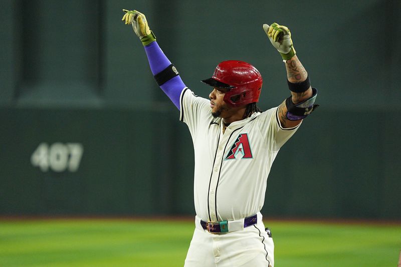 Jun 28, 2024; Phoenix, Arizona, USA; Arizona Diamondbacks infielder Ketel Marte (4) celebrates after a double in the seventh inning against the Oakland Athletics at Chase Field. Mandatory Credit: Allan Henry-USA TODAY Sports