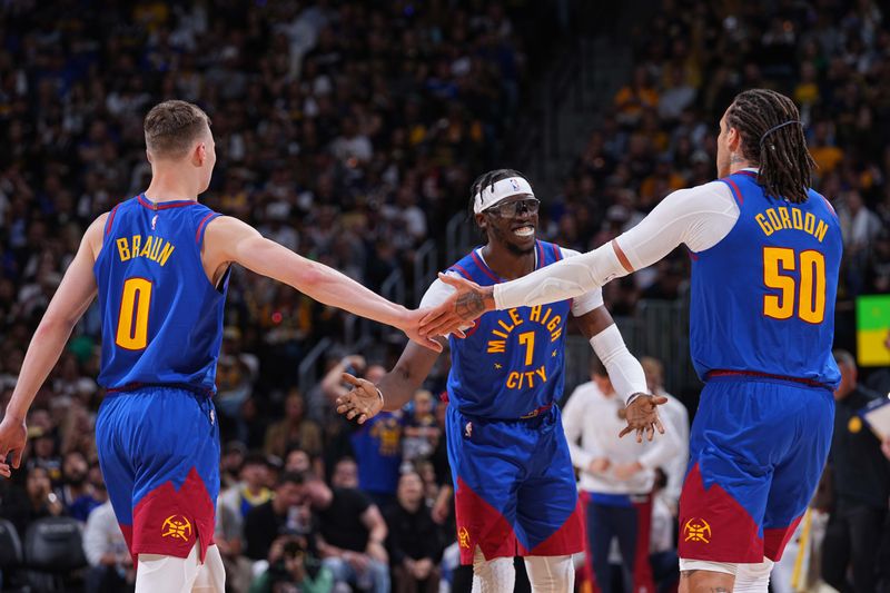 DENVER, CO - OCTOBER 24: Christian Braun #0, Aaron Gordon #50, and Reggie Jackson #7 of the Denver Nuggets high five during the game against the Los Angeles Lakers on October 24, 2023 at the Ball Arena in Denver, Colorado. NOTE TO USER: User expressly acknowledges and agrees that, by downloading and/or using this Photograph, user is consenting to the terms and conditions of the Getty Images License Agreement. Mandatory Copyright Notice: Copyright 2023 NBAE (Photo by Bart Young/NBAE via Getty Images)