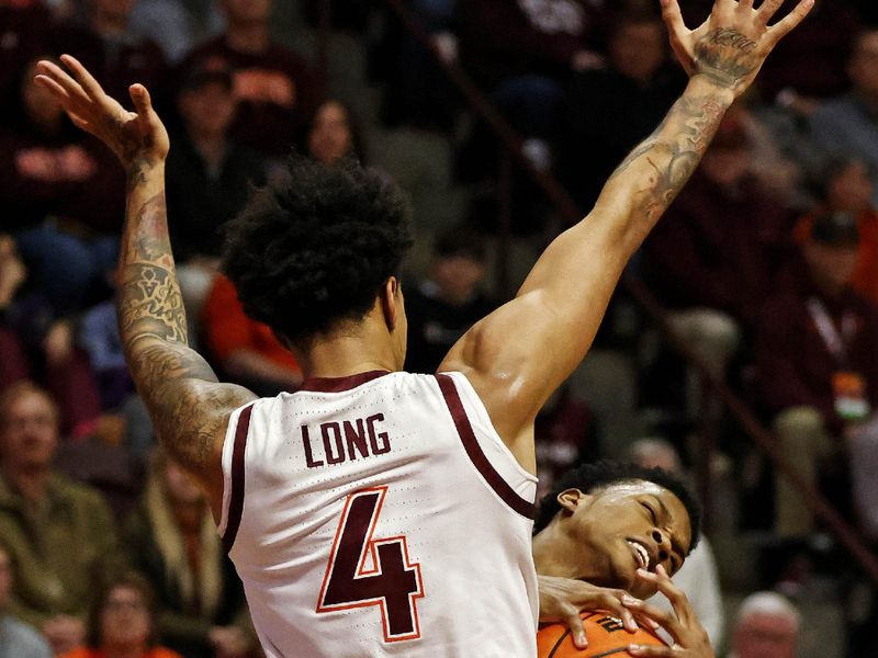 Jan 10, 2024; Blacksburg, Virginia, USA; Clemson Tigers forward RJ Godfrey (10) drives to the basket against Virginia Tech Hokies forward Mekhi Long (4) during the first half at Cassell Coliseum. Mandatory Credit: Peter Casey-USA TODAY Sports