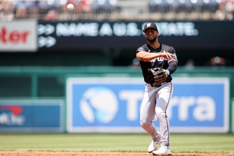 Jun 16, 2024; Washington, District of Columbia, USA; Miami Marlins second base Otto Lopez (61) makes a throw during the fifth inning in a game against the Washington Nationals at Nationals Park. Mandatory Credit: Daniel Kucin Jr.-USA TODAY Sports