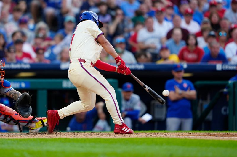 Sep 14, 2024; Philadelphia, Pennsylvania, USA; Philadelphia Phillies center fielder Cal Stevenson (47) hits an RBI double against the New York Mets during the seventh inning at Citizens Bank Park. Mandatory Credit: Gregory Fisher-Imagn Images