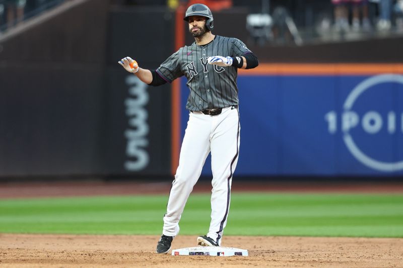 Sep 7, 2024; New York City, New York, USA;  New York Mets designated hitter J.D. Martinez (28) gestures after hitting a two-run double in the sixth inning against the Cincinnati Reds at Citi Field. Mandatory Credit: Wendell Cruz-Imagn Images