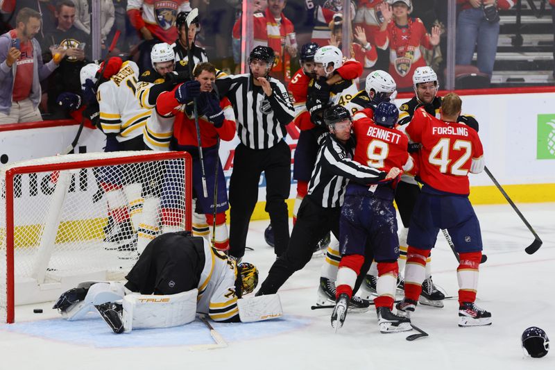 Oct 8, 2024; Sunrise, Florida, USA; Florida Panthers and Boston Bruins players fight during the third period at Amerant Bank Arena. Mandatory Credit: Sam Navarro-Imagn Images