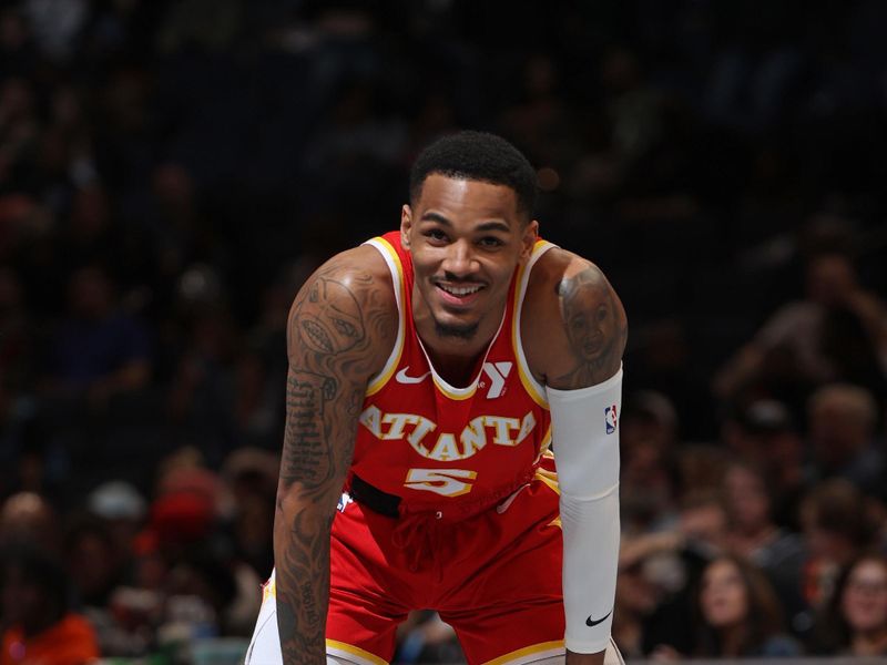 MEMPHIS, TN - MARCH 8: Dejounte Murray #5 of the Atlanta Hawks smiles during the game against the Memphis Grizzlies on March 8, 2024 at FedExForum in Memphis, Tennessee. NOTE TO USER: User expressly acknowledges and agrees that, by downloading and or using this photograph, User is consenting to the terms and conditions of the Getty Images License Agreement. Mandatory Copyright Notice: Copyright 2024 NBAE (Photo by Joe Murphy/NBAE via Getty Images)