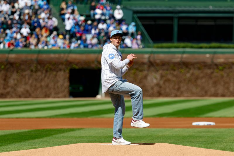 Apr 26, 2025; Chicago, Illinois, USA; Indianapolis Colts wide receiver Alec Pierce throws out a ceremonial first pitch before a baseball game between the Chicago Cubs and Philadelphia Phillies at Wrigley Field. Mandatory Credit: Kamil Krzaczynski-Imagn Images