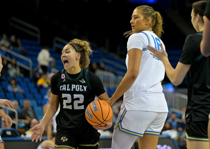 Dec 16, 2025; Los Angeles, California, USA;  Cal Poly Mustangs guard Alana Goosby (22) reacts after getting possession of the ball as UCLA Bruins forward Sienna Betts (16) looks on during the first half at Pauley Pavilion presented by Wescom Financial. Mandatory Credit: Jayne Kamin-Oncea-Imagn Images