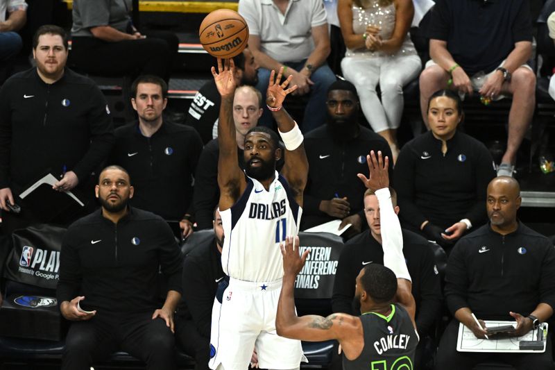 MINNEAPOLIS, MINNESOTA - MAY 30: Kyrie Irving #11 of the Dallas Mavericks shoots a three point basket during the first quarter against the Minnesota Timberwolves in Game Five of the Western Conference Finals at Target Center on May 30, 2024 in Minneapolis, Minnesota. NOTE TO USER: User expressly acknowledges and agrees that, by downloading and or using this photograph, User is consenting to the terms and conditions of the Getty Images License Agreement. (Photo by Stephen Maturen/Getty Images)