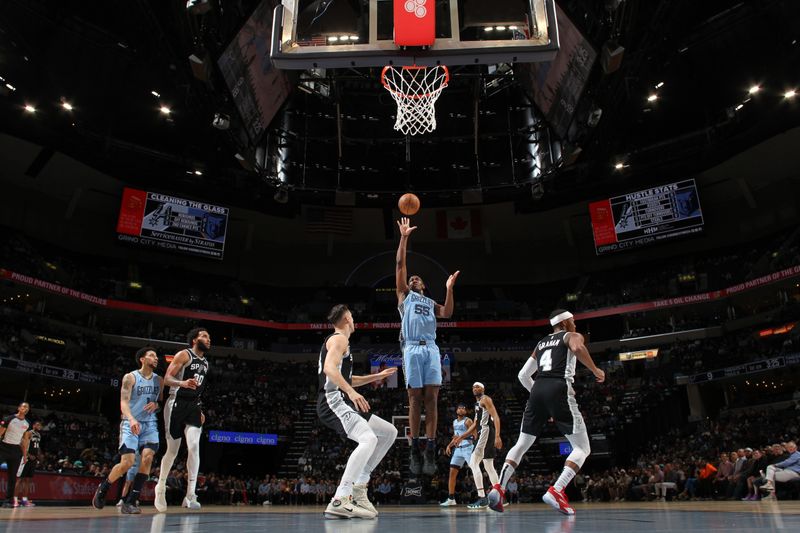 MEMPHIS, TN - APRIL 9: Trey Jemison #55 of the Memphis Grizzlies shoots the ball during the game against the San Antonio Spurs on April 9, 2024 at FedExForum in Memphis, Tennessee. NOTE TO USER: User expressly acknowledges and agrees that, by downloading and or using this photograph, User is consenting to the terms and conditions of the Getty Images License Agreement. Mandatory Copyright Notice: Copyright 2024 NBAE (Photo by Joe Murphy/NBAE via Getty Images)