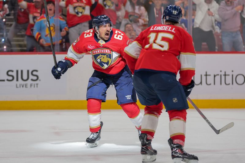 May 9, 2025; Sunrise, Florida, USA; Florida Panthers center Brad Marchand (63) celebrates after scoring the game-winning goal against the Toronto Maple Leafs during overtime in game three of the second round of the 2025 Stanley Cup Playoffs at Amerant Bank Arena. Mandatory Credit: Sam Navarro-Imagn Images