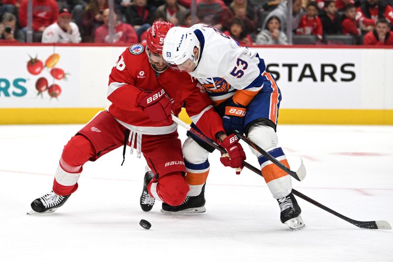 Nov 21, 2024; Detroit, Michigan, USA;  Detroit Red Wings defenseman Erik Gustafsson (56) and New York Islanders center Casey Cizikas (53) battle for the puck in the first period at Little Caesars Arena. Mandatory Credit: Lon Horwedel-Imagn Images