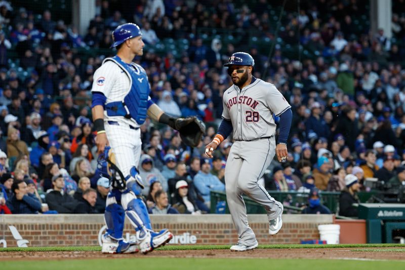 Apr 24, 2024; Chicago, Illinois, USA; Houston Astros first baseman Jon Singleton (28) scores against the Chicago Cubs during the third inning at Wrigley Field. Mandatory Credit: Kamil Krzaczynski-USA TODAY Sports