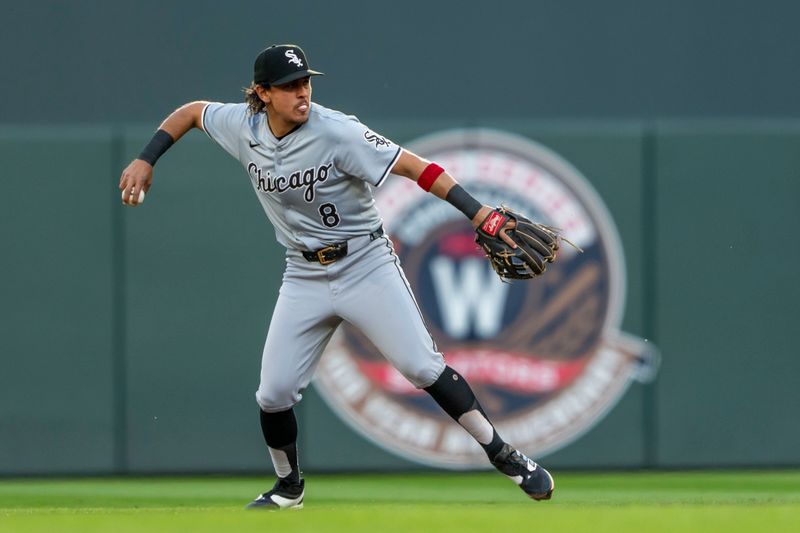 Apr 22, 2024; Minneapolis, Minnesota, USA; Chicago White Sox second baseman Nicky Lopez (8) throws the ball to first base for an out against the Minnesota Twins in the first inning at Target Field. Mandatory Credit: Jesse Johnson-USA TODAY Sports