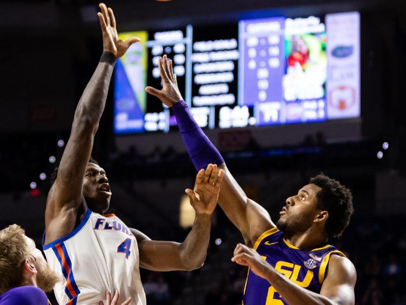 Feb 13, 2024; Gainesville, Florida, USA; Florida Gators forward Tyrese Samuel (4) shoots over LSU Tigers guard Jordan Wright (6) and LSU Tigers forward Hunter Dean (12) during the second half at Exactech Arena at the Stephen C. O'Connell Center. Mandatory Credit: Matt Pendleton-USA TODAY Sports