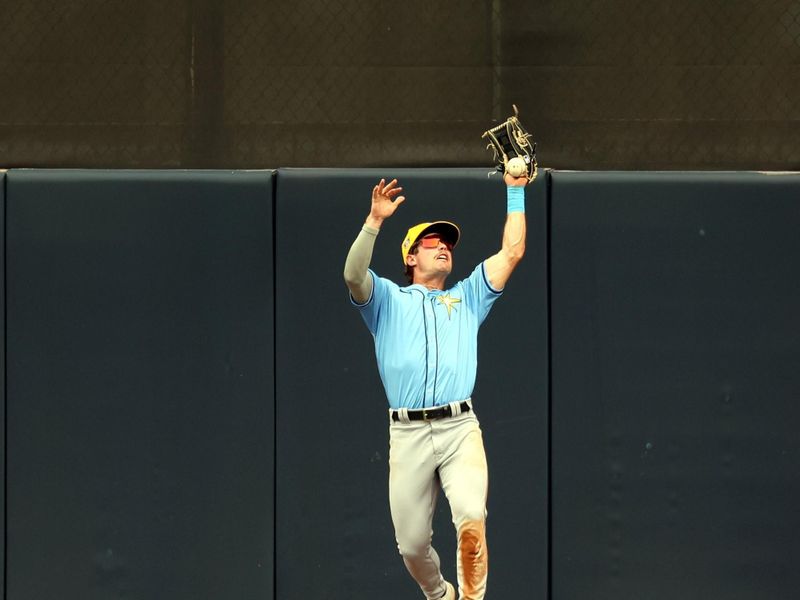 Mar 6, 2024; Tampa, Florida, USA;  Tampa Bay Rays left fielder Jonny Deluca (21) misses a fly ball during the fifth inning at George M. Steinbrenner Field. Mandatory Credit: Kim Klement Neitzel-USA TODAY Sports