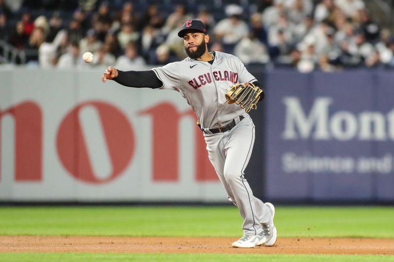 May 2, 2023; Bronx, New York, USA;  Cleveland Guardians shortstop Amed Rosario (1) throws a runner out at first base in the fourth inning against the New York Yankees at Yankee Stadium. Mandatory Credit: Wendell Cruz-USA TODAY Sports