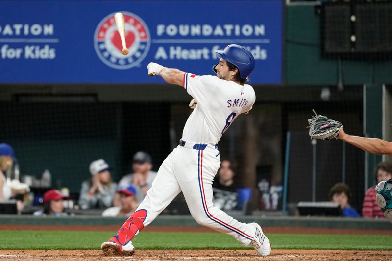 Apr 24, 2024; Arlington, Texas, USA; Texas Rangers third baseman Josh Smith (8) loses his bat on a strike thrown by Seattle Mariners pitcher Bryce Miller (not shown) during the second inning at Globe Life Field. Mandatory Credit: Jim Cowsert-USA TODAY Sports