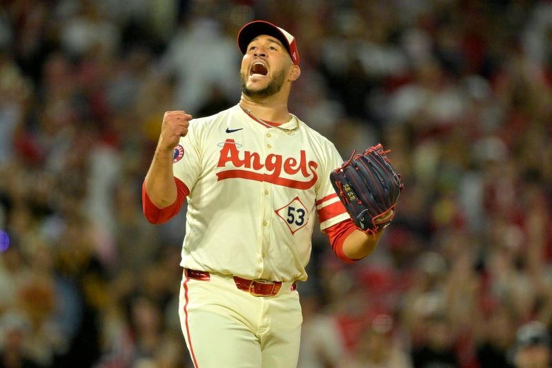 Jul 13, 2024; Anaheim, California, USA;  Carlos Estevez #53 of the Los Angeles Angels celebrates as he earns his 17th save of the season defeating the Seattle Mariners in the ninth inning at Angel Stadium. Mandatory Credit: Jayne Kamin-Oncea-USA TODAY Sports