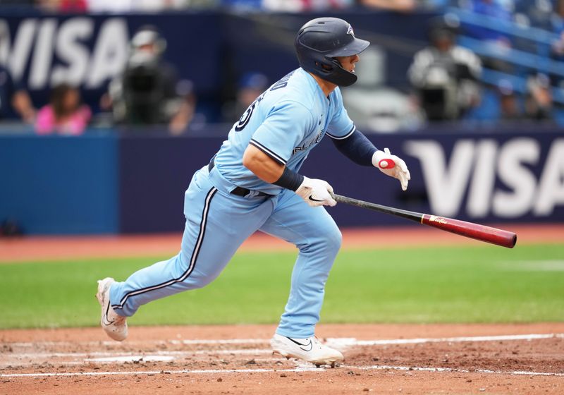 Aug 30, 2023; Toronto, Ontario, CAN; Toronto Blue Jays center fielder Daulton Varsho (25) hits a double against the Washington Nationals during the sixth inning at Rogers Centre. Mandatory Credit: Nick Turchiaro-USA TODAY Sports