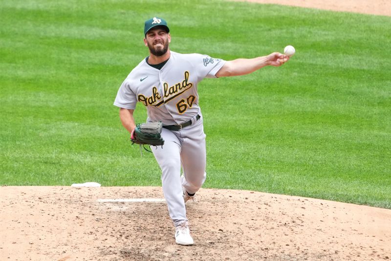 Jul 30, 2023; Denver, Colorado, USA; Oakland Athletics relief pitcher Sam Moll (60) pitches in the sixth inning against the Colorado Rockies at Coors Field. Mandatory Credit: Ron Chenoy-USA TODAY Sports