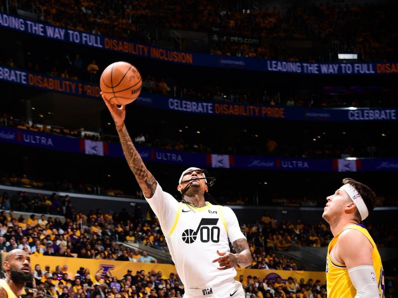 LOS ANGELES, CA - FEBRUARY 10:  Jordan Clarkson #00 of the Utah Jazz drives to the basket during the game against the Los Angeles Lakers on February 10, 2025 at Crypto.Com Arena in Los Angeles, California. NOTE TO USER: User expressly acknowledges and agrees that, by downloading and/or using this Photograph, user is consenting to the terms and conditions of the Getty Images License Agreement. Mandatory Copyright Notice: Copyright 2025 NBAE (Photo by Adam Pantozzi/NBAE via Getty Images)