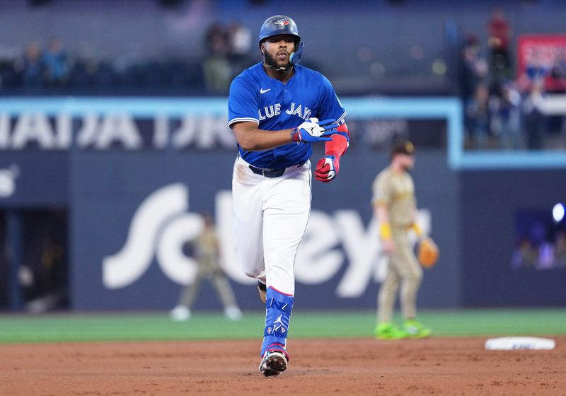 May 20, 2025; Toronto, Ontario, CAN; Toronto Blue Jays first baseman Vladimir Guerrero Jr. (27) runs the bases after hitting a home run against the San Diego Padres during the first inning at Rogers Centre. Mandatory Credit: Nick Turchiaro-Imagn Images