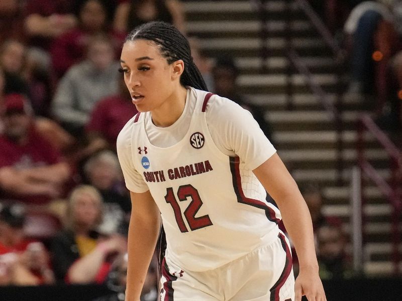 Mar 25, 2023; Greenville, SC, USA;  South Carolina Gamecocks guard Brea Beal (12) back on defense against the UCLA Bruins during the second half of the NCAA Women s Tournament at Bon Secours Wellness Arena. Mandatory Credit: Jim Dedmon-USA TODAY Sports