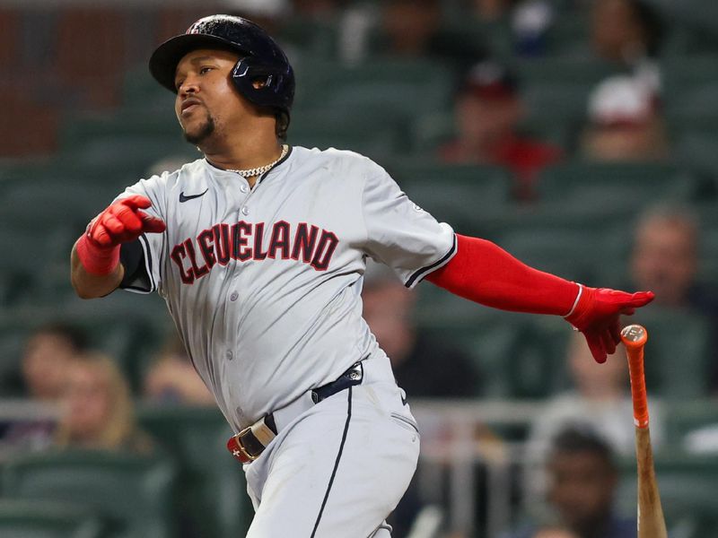 Apr 26, 2024; Atlanta, Georgia, USA; Cleveland Guardians third baseman Jose Ramirez (11) hits a single against the Atlanta Braves in the ninth inning at Truist Park. Mandatory Credit: Brett Davis-USA TODAY Sports