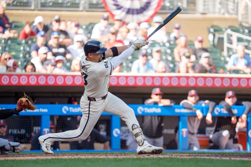 Sep 21, 2025; Minneapolis, Minnesota, USA; Minnesota Twins third base Royce Lewis (23) at bat against Cleveland Guardians pitcher Hunter Gaddis (33) in the seventh inning at Target Field. Mandatory Credit: Matt Blewett-Imagn Images