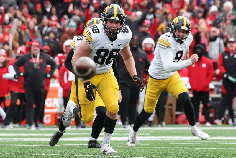 Nov 24, 2023; Lincoln, Nebraska, USA; Iowa Hawkeyes tight end Steven Stilianos (86) chases down a loose ball against the Nebraska Cornhuskers at Memorial Stadium. Mandatory Credit: Reese Strickland-USA TODAY Sports