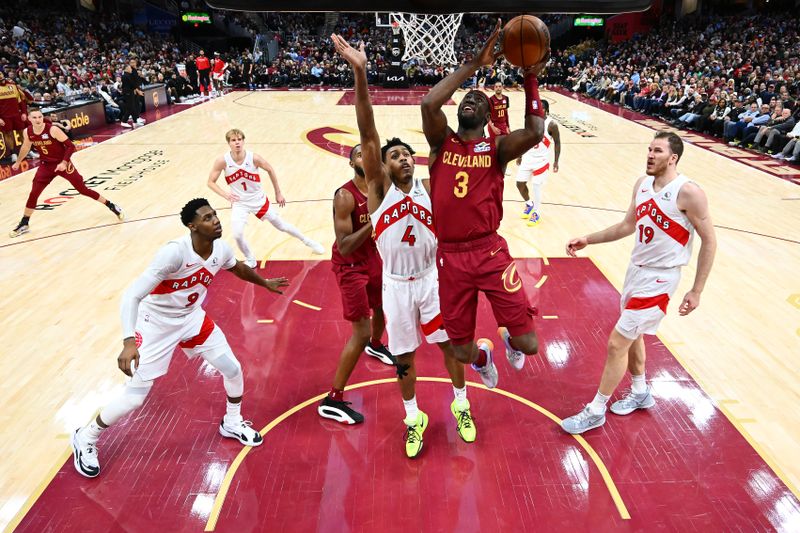 CLEVELAND, OHIO - JANUARY 09: Caris LeVert #3 of the Cleveland Cavaliers goes up for a shot against Scottie Barnes #4 of the Toronto Raptors during the fourth quarter at Rocket Mortgage Fieldhouse on January 09, 2025 in Cleveland, Ohio. The Cavaliers defeated the Raptors 132-126. NOTE TO USER: User expressly acknowledges and agrees that, by downloading and or using this photograph, User is consenting to the terms and conditions of the Getty Images License Agreement. (Photo by Jason Miller/Getty Images)