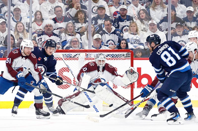 Apr 30, 2024; Winnipeg, Manitoba, CAN; Winnipeg Jets left wing Kyle Connor (81) shoots on Colorado Avalanche goaltender Alexandar Georgiev (40) in the first period in game five of the first round of the 2024 Stanley Cup Playoffs at Canada Life Centre. Mandatory Credit: James Carey Lauder-USA TODAY Sports